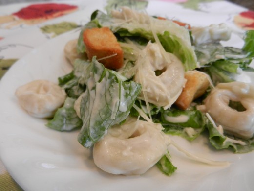 Tortellini salad with Parmesan cheese and croutons. 