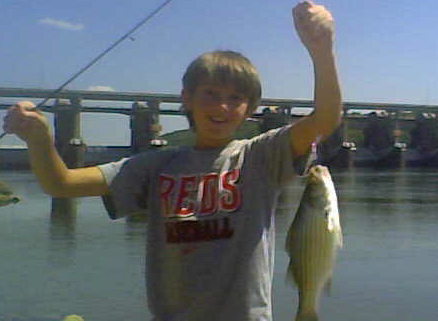 Adam Hoff Hoists a Nice Late Summer Hybrid Striped Bass Caught on the Ohio River Below Markland Dam