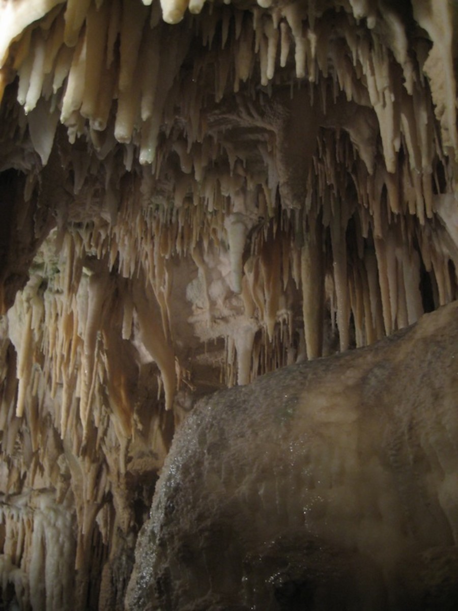 Stalactites and a huge limestone rock in the foreground.
