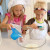 Alex and Grace combine the wet ingredients first. Alex and Grace combine the wet ingredients first.