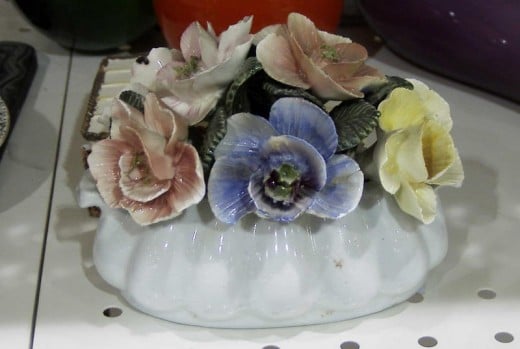 I photographed this bone china posie at a thrift store. It was a bit pricey for the amount of chips and broken flowers/ petals. I didn't buy it.