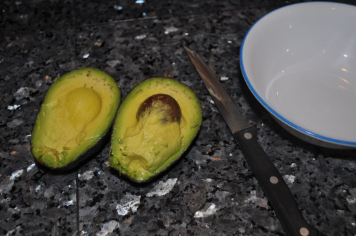 An avocado cut in half.