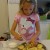Grace carefully glazes each of the cooled lemon cookies.