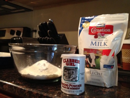 Dry milk and powdered ingredients in medium bowl
