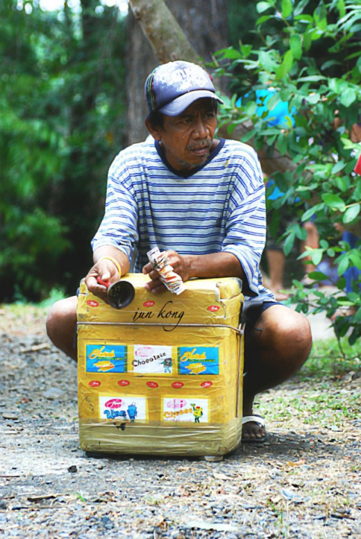 Ice Cream Man with his convenient crate of frozen delights.