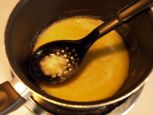 Skim with a slotted spoon.