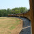 As the train rounds the curve, passengers can see the entire length of the train. As the train rounds the curve, passengers can see the entire length of the train.