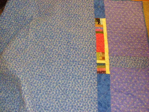 I took leftover pieces from the front of the quilt and used them up on the back of the quilt. 