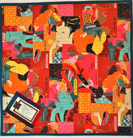 Barb's use of interesting fabrics for her quilt backs allow her to show her personality and whimsy. This one looks like a collage, but is just one piece of fabric.