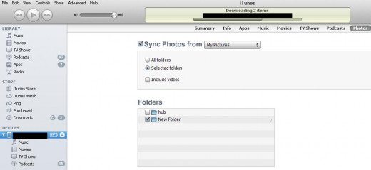 Check the "Sync Photos From" box, then select which folders you want to sync. Click "Sync" when you're done.