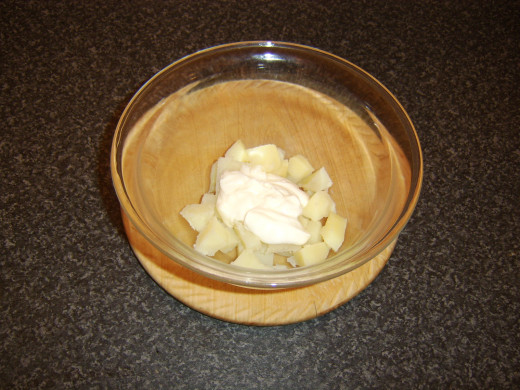 Diced potato is mixed with mayo