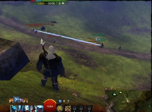 Two small groups of players in a WvWvW match fight for control near a strategic point.