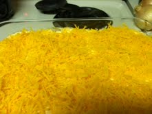 Top with the final layer of sharp cheddar cheese shreds.