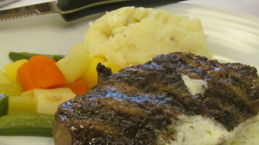 The first dinner on the ship consisted of Sirloin Steak, baked potatoes and green beans.
