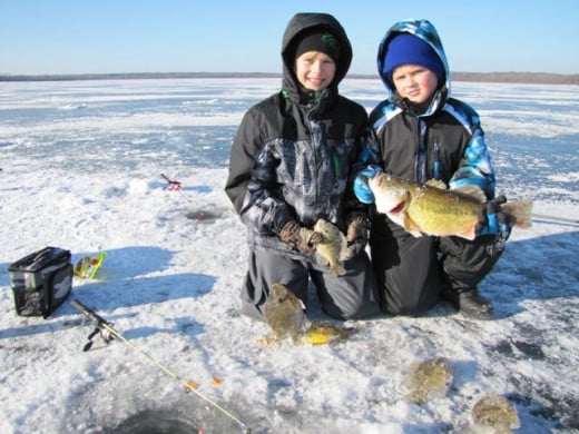 Fishing for bass under the ice with rod and reel.