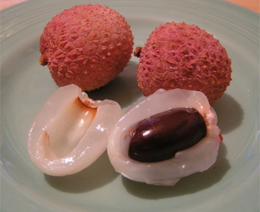 When ripe, the rough pink-colored rind of the Lychee can easily be pulled back to reveal the white-colored edible portion of the fruit, which is  translucent, sweet, and juicy. The seeds should not be eaten.