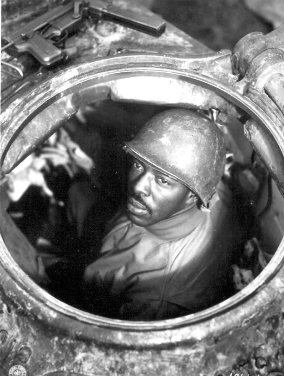WW2: Cpl. Carlton Chapman is a machine-gunner in an M-4 tank, attached to a Motor Transport unit near Nancy, France. 761st Mt. Bn. November 5, 1944.