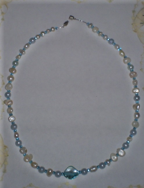 Add the barrel clasp to both ends of the necklace.