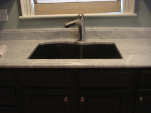 If you want to play up the paint or other wall features, a small backsplash works great.  Add interesting detail with a special cut to the edge.