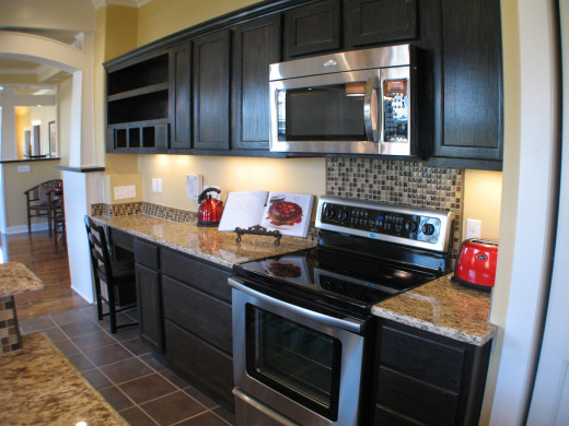 You can vary the sizes of the backsplash to create a focal point without changing materials.