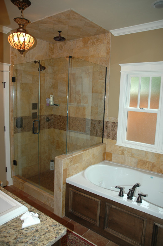 Unify the shower and tub areas by using the same tiles and patterns.