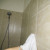 Wiping Off the Water on A Bathroom Wall Wiping Off the Water on A Bathroom Wall