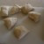 Cut the risen dough into six equal pieces. Cut the risen dough into six equal pieces.