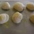 Form the dough into boules, place on the baking sheet, and sprinkle with more cornmeal. Form the dough into boules, place on the baking sheet, and sprinkle with more cornmeal.