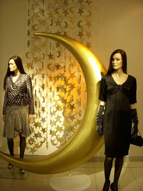 Mannequins displaying clothing, shoes, and accessories.