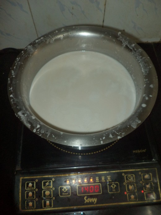 Coconut milk on stove ready for cooking