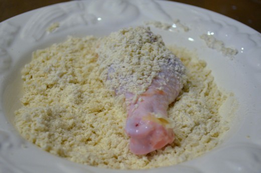 Lightly coat the buttermilk coated chicken legs in panko/flour mixture.