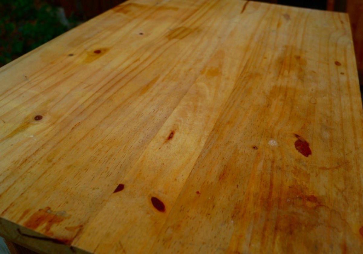 This is the top of the table, and it's got some dirt and light stains from using it without staining the wood first.