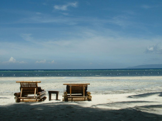 Empty beach chairs, Ananyana Beach Resort, Panglao Island, Bohol, Philippines. Copyright Rod Martin, Jr.
