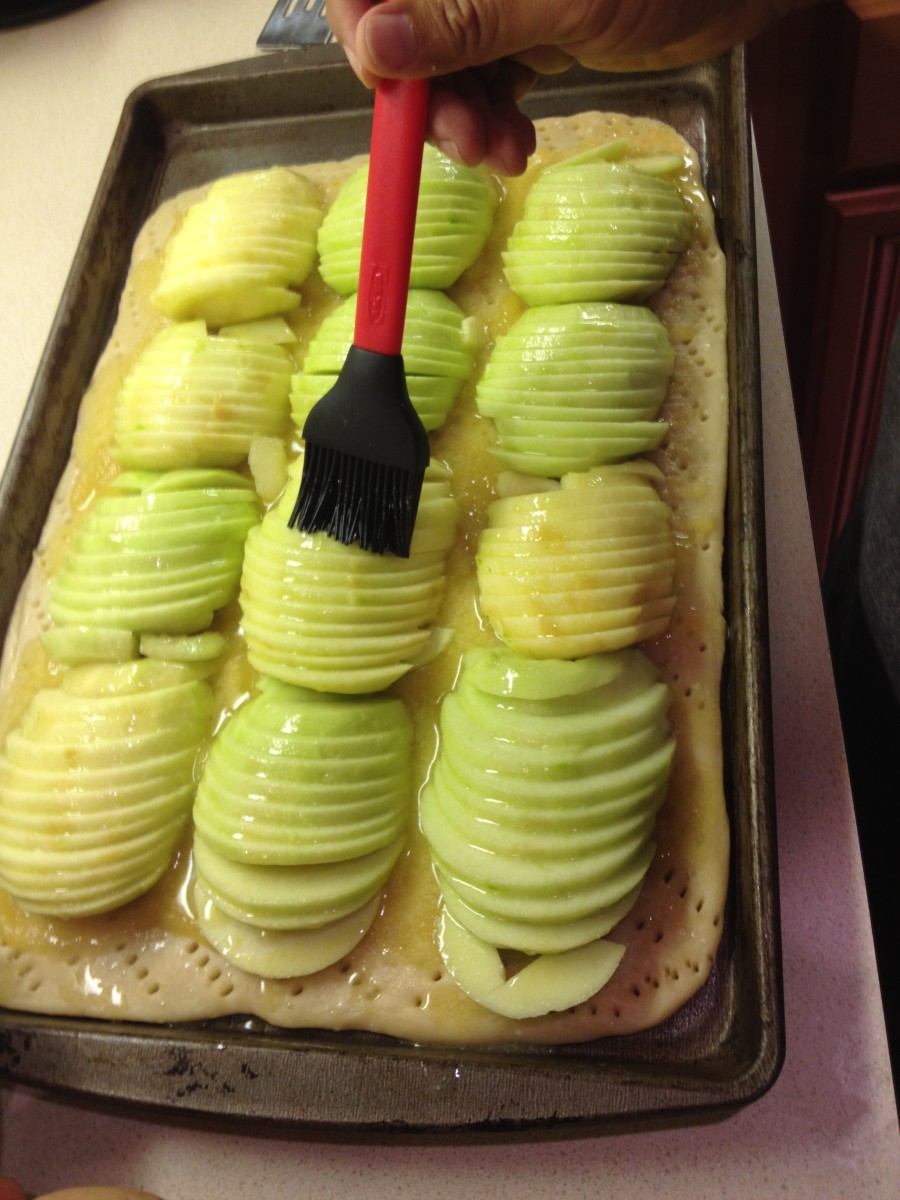 Brush apple slices with melted butter.