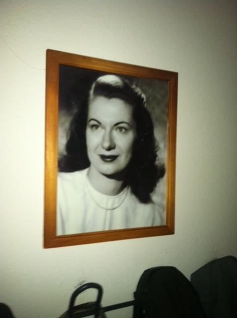That is a real lady in the photo, but that is not really her, because it is "just" a photo?