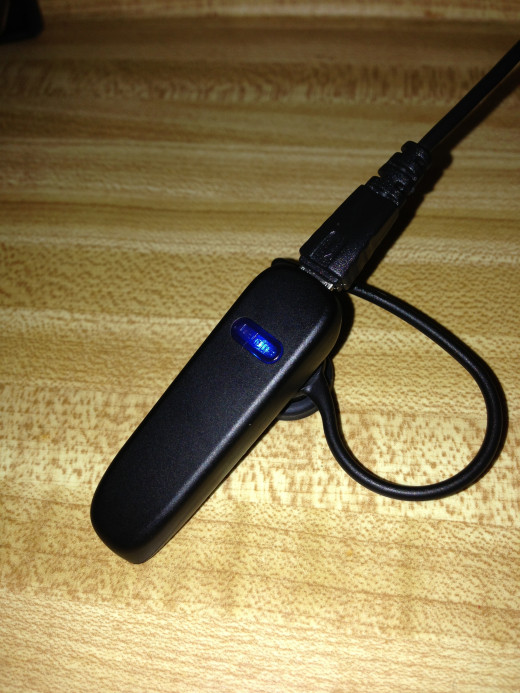Charge your Jabra Bluetooth headset using the AC adapter that comes with the headset. It will be fully charged when the indicator light stays a steady blue.