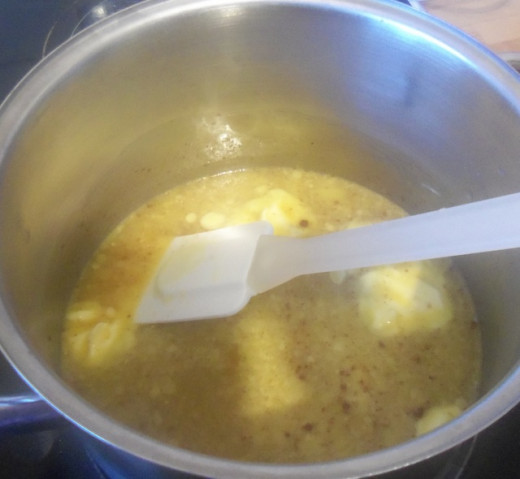 Melt the butter and then mix in the orange juice and sugar.  