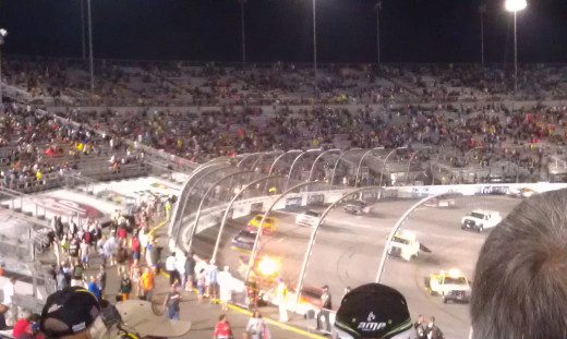 Jet dryers and race cars drying the track before the race starts.