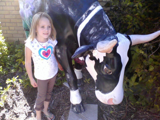 my daughter and one of the local cows