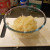 Using a cheese grater, grate both potatoes into a mixing bowl.