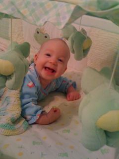 pic of happy baby in crib