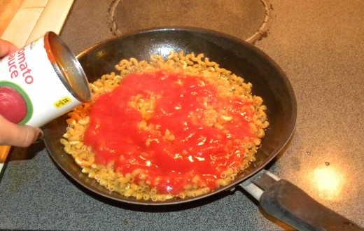 Add can of tomato to noodles, just heat quickly