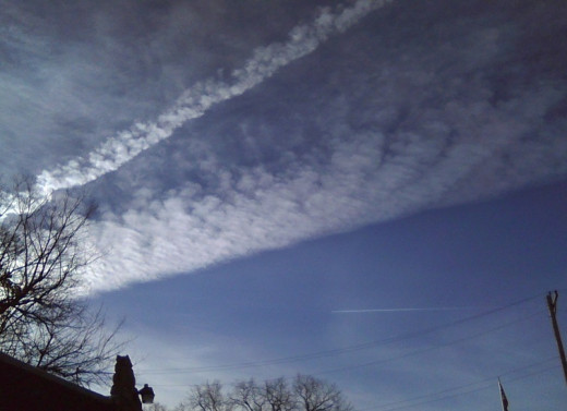 Good weather will often bring the spraying of chemtrails.  These were very large ones looking up from my back yard.