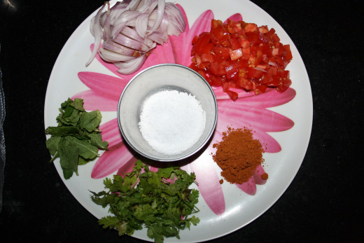 Onion, tomato, biryani masala, curry leaves, cilantro and salt (garlic not shown in picture)