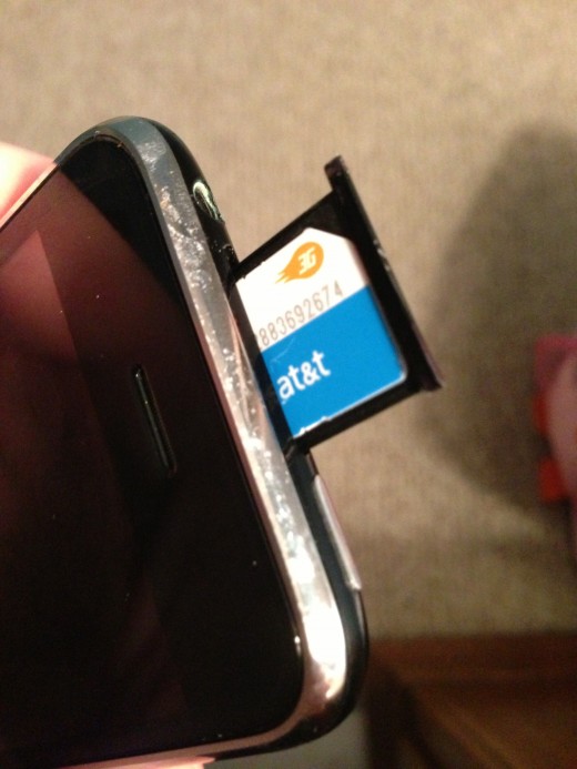 Carefully pull the SIM card tray out and then remove the SIM card from the tray.
