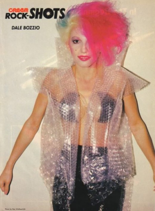 80's singer wears a bubble wrap top.