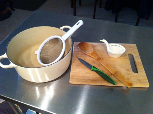 The tools are simple. The pot should be heavy, such as enameled cast iron. The strainer is somewhat optional, and you may find using scissors to be easier than a knife. 