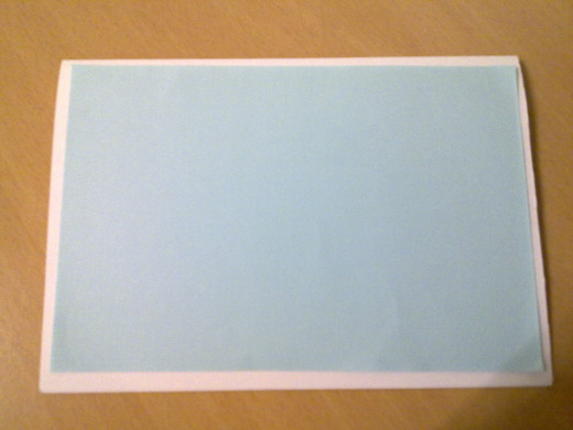 Paste the blue paper over the white card