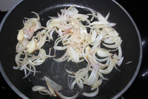 Fry onion adding it to garlic