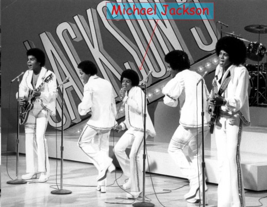 Michael Jackson, performing with his siblings.